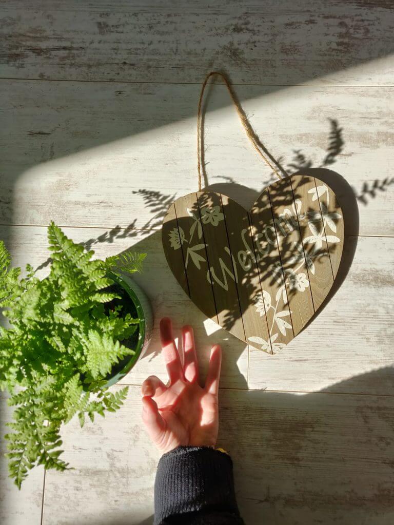 Love sign with flower and hand on the floor.